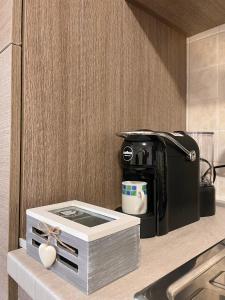 a coffee maker on a counter in a kitchen at CASA GIULIA - Holiday Home in Olbia