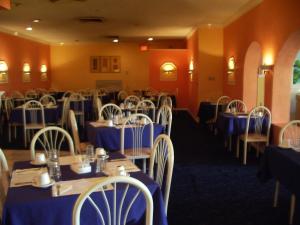 A restaurant or other place to eat at Royal Islander Hotel