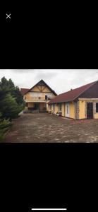 a picture of a building with a parking lot at Siófoki Álom in Siófok