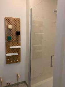 a shower in a bathroom with a glass shower stall at Central Studio in Kortrijk in Kortrijk