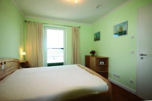 Postel nebo postele na pokoji v ubytování Villa Bernstein