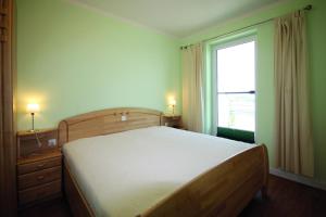 Postel nebo postele na pokoji v ubytování Villa Bernstein