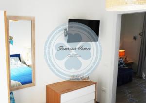 A bed or beds in a room at Seasons Home San Foca
