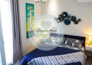 A bed or beds in a room at Seasons Home San Foca