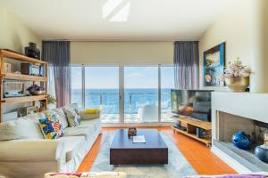 a living room with a view of the ocean at Beach House in Santa Cruz