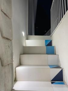 a set of stairs with blue and white at La Pigolina Blue in Positano