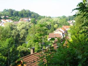 a view of a town with a river and trees at Bei München Ferienwohnung in Grafrath "Amperland" in Grafrath