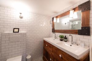 a bathroom with a sink and a mirror at Chalet Figue in Morzine +17 photos