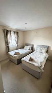 Ένα ή περισσότερα κρεβάτια σε δωμάτιο στο Tobar Oisinn