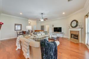 a living room with two couches and a fireplace at Spacious Zachary Home 12 Mi to Baton Rouge! in Zachary