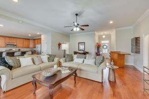 a living room with two couches and a table at Spacious Zachary Home 12 Mi to Baton Rouge! in Zachary
