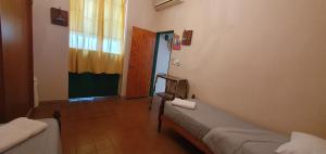 a hospital room with two beds and a window at Nuestro Quincho in La Rioja