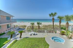 a view of the beach from the balcony of a house at Pineapple Villas in Panama City Beach