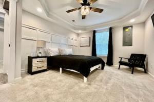 a bedroom with a bed and a ceiling fan at Amazing riverside New Construction home in Middletown in Middletown