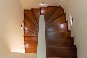 a staircase with wood paneling in a house at Samos Tropic Apartments in Ríva