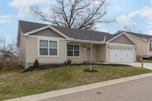 a house with a garage and a driveway at BRAND NEW Home away from Home among the Nook in Hamilton