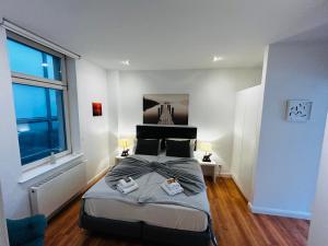 Ein Bett oder Betten in einem Zimmer der Unterkunft Downtown Apartments Leipzig