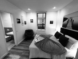 Ein Bett oder Betten in einem Zimmer der Unterkunft Downtown Apartments Leipzig