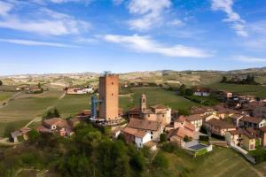 an aerial view of a small village with a castle at La Terrazza del Barbaresco in Barbaresco