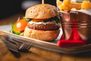 a sandwich on a plate with french fries at The Manor in St Bees