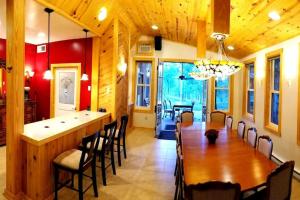 a dining room with a wooden table and chairs at Zen Suite in Stanardsville
