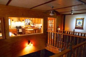 a view of a living room and kitchen in a house at Balcony Suite at White Lotus Eco Spa Retreat in Stanardsville