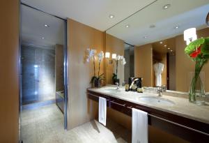 a bathroom with a sink and a shower at Eurostars Grand Marina Hotel GL in Barcelona