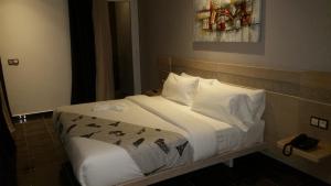 A bed or beds in a room at Hotel A44