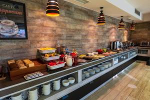 a buffet line with many different types of food at Jazz Hotel in Tbilisi City