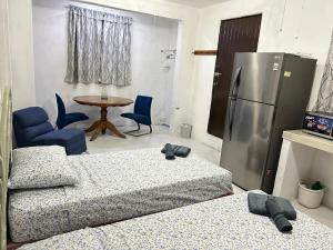 A bed or beds in a room at Cancun Estudio 9-C