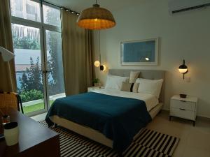 Postel nebo postele na pokoji v ubytování Kasa Residences Punta Cana.