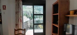 a room with a window with a view of a balcony at VFT Castillo de la Yedra in Cazorla