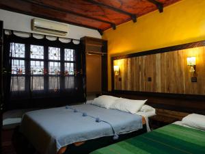 Säng eller sängar i ett rum på La Kasbah Elkhorbat Muxu Berbere