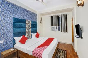 Ліжко або ліжка в номері Flagship Hotel Atithi