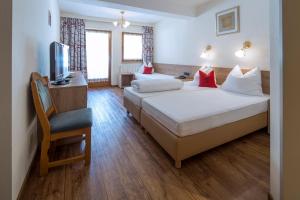 Letto o letti in una camera di Ferienhotel Fuchs