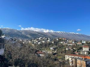 a view of a city with mountains in the background at Hostel Mateo in Gjirokastër