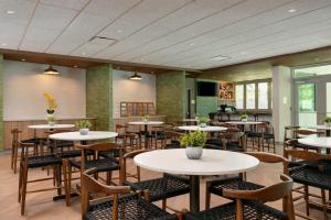 a restaurant with tables and chairs in a room at Fairfield by Marriott Luquillo Beach in Luquillo