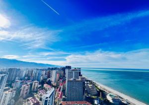 an aerial view of the ocean and a city at Orbi city Sea view 5star in Batumi