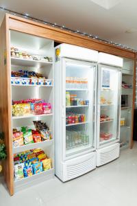 an open refrigerator with food inside of it at Days Inn by Wyndham Rio de Janeiro Lapa in Rio de Janeiro