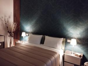Una cama o camas en una habitación de La Dama dei Fiori