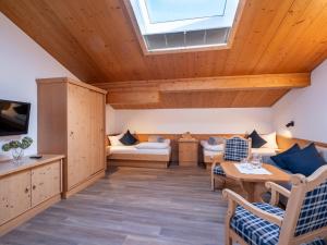 a living room with a skylight on the ceiling at Apart Denise in Fügen