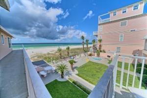 a view of the beach from the balcony of a condo at Pineapple Villas in Panama City Beach