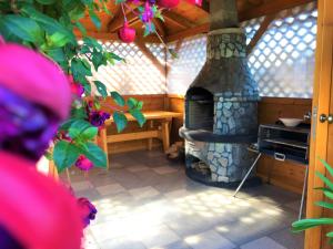 a room with a stone stove in a house at Penzión Jany in Zuberec