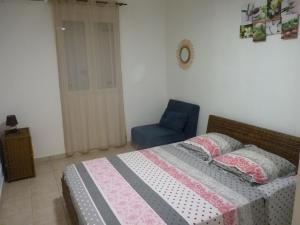 Ένα ή περισσότερα κρεβάτια σε δωμάτιο στο Bel appartement Résidence Crystal beach avec citerne individuelle +7 φωτογραφίες