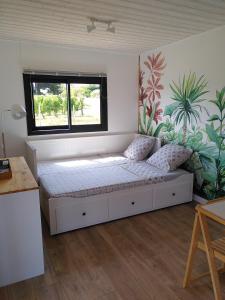 Postel nebo postele na pokoji v ubytování Maison sur pilotis