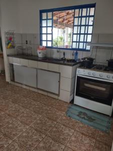 Kjøkken eller kjøkkenkrok på Sítio Cantinho da Cachoeira