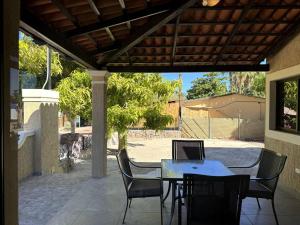 a table and chairs with a laptop on a patio at Habitación #2 en el Centro Histórico de Loreto in Loreto