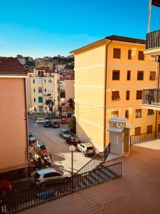 a view of a street with cars parked in a parking lot at Casa vacanze LA NINA in Varazze