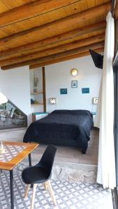 Postel nebo postele na pokoji v ubytování Cabaña La Emilia - Villa Giardino