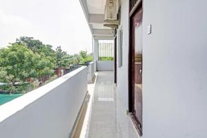 an empty balcony of a house with a view at OYO Flagship A Delight Residency in Hyderabad